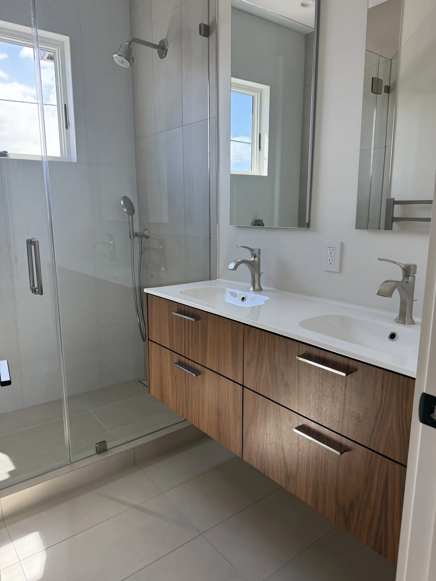 White bathroom interior with blue mosaic accents