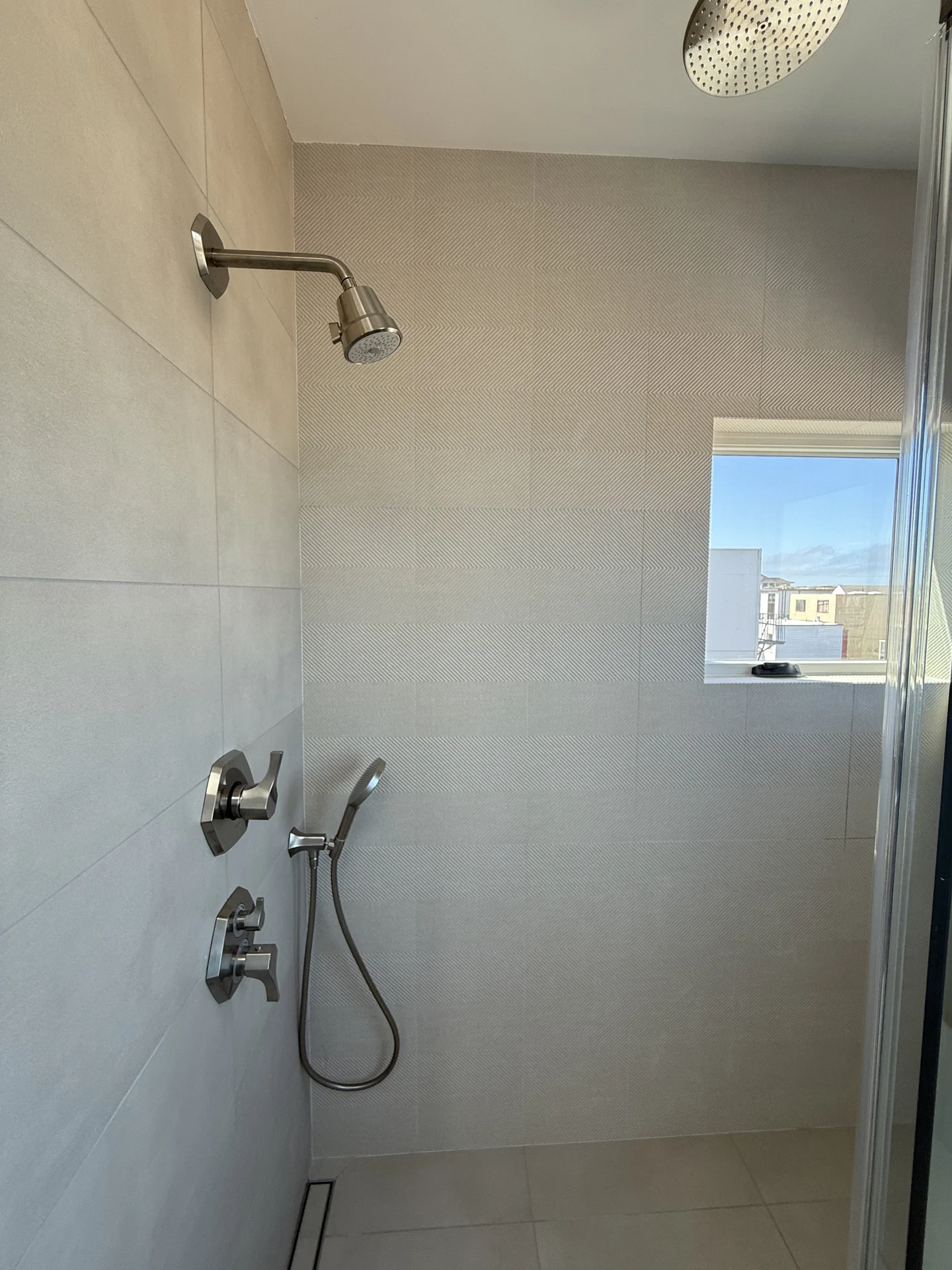 Sophisticated bathroom with tub, sink, and mirror